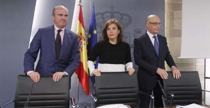 De Guindos, Santamaría y Montoro tras el Consejo de Ministros de este viernes